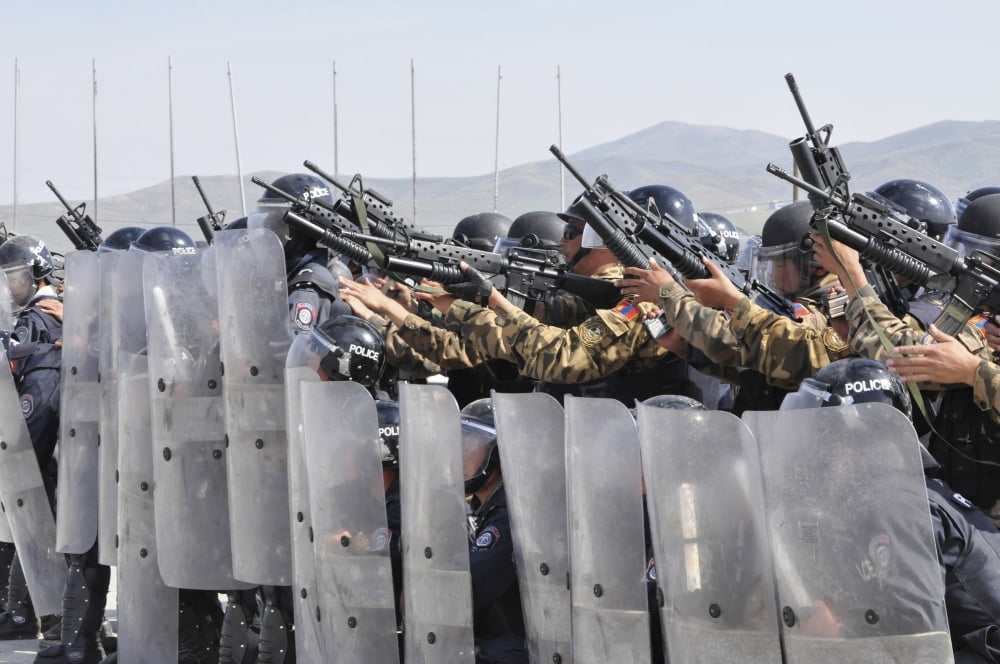 Members of the Mongolian Internal Forces prepare to fire foam baton-and-ball grenades Canvas Art - Stocktrek Images (35 x 23)