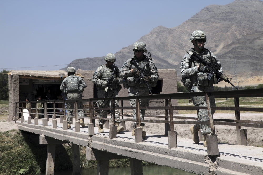Members of the Provincial Reconstruction Team walk through a construction site in Afghanistan Canvas Art - Stocktrek Images (34 x 23)
