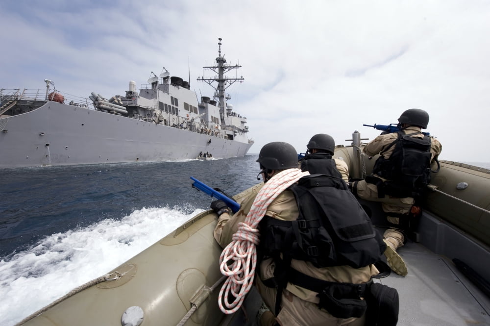 Members of the visit board search and seizure team approach their ship in preparation for a mock drill Canvas Art - Stocktrek Images (34 x 23)