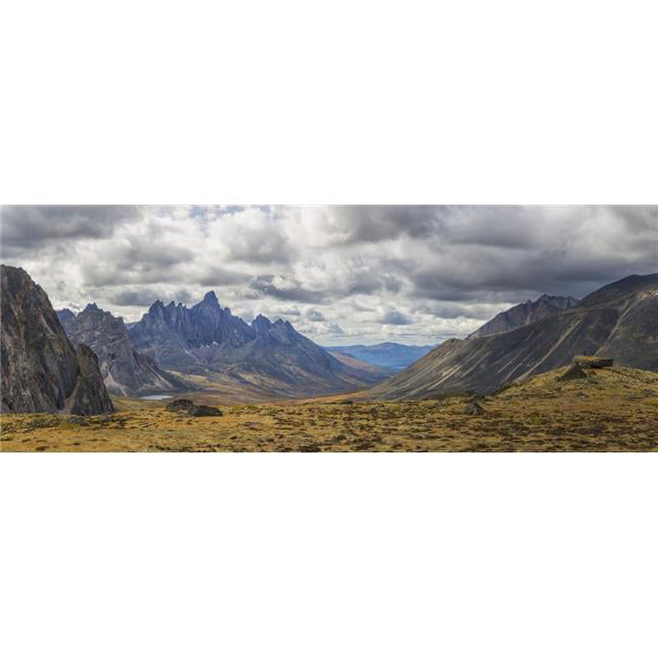 Men Standing on A Boulder in The Distance in Tombstone Territorial Park