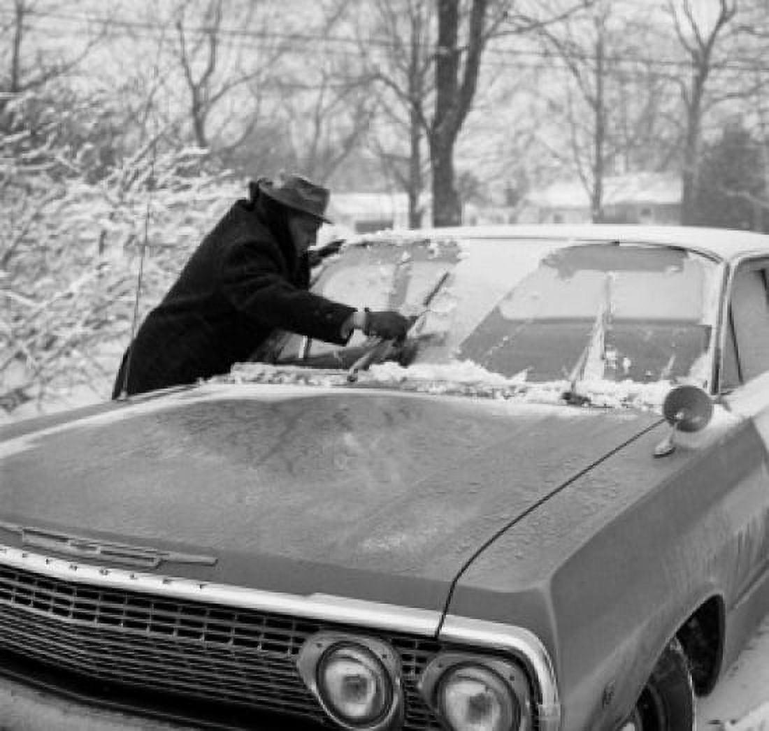 Men cleaning car from snow Canvas Art - (24 x 36)