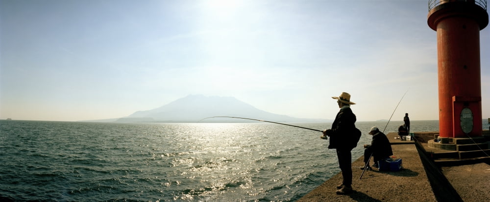 Men fishing in Sakurajima Island Kagoshima Kagoshima Prefecture japan Canvas Art - Panoramic Images (36 x 12)