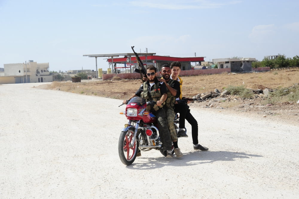 Men from the Free Syrian Army on a motorcycle in Azaz Syria Canvas Art - Andrew ChittockStocktrek Images (18 x 12)