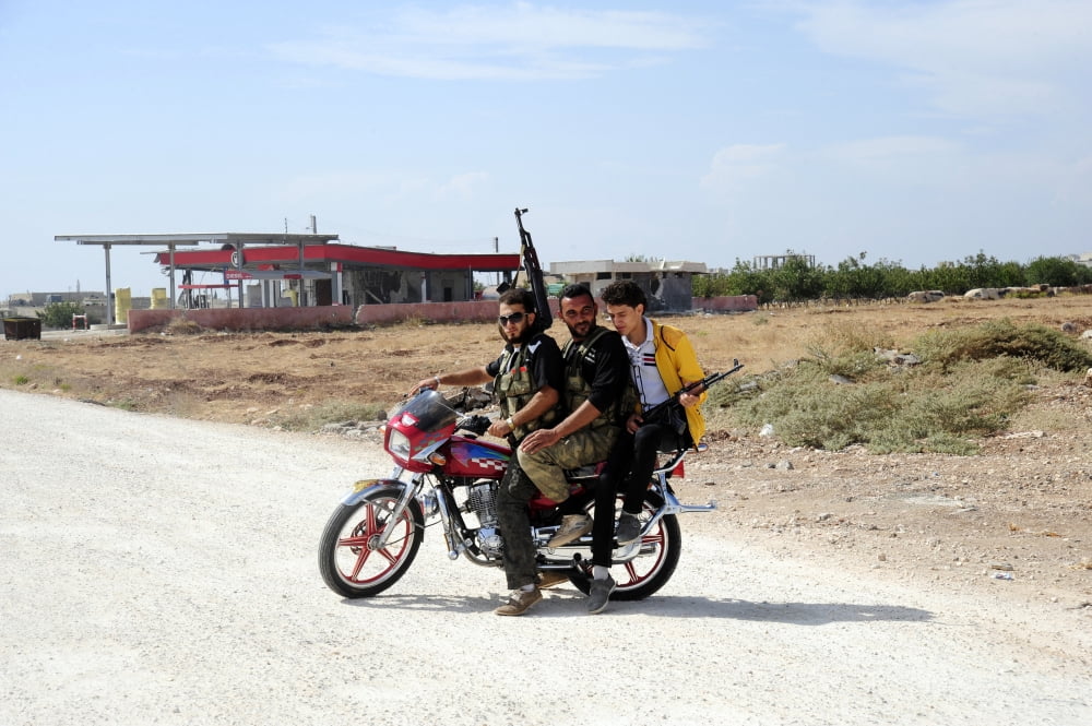 Men from the Free Syrian Army on a motorcycle in Azaz Syria Canvas Art - Andrew ChittockStocktrek Images (18 x 12)