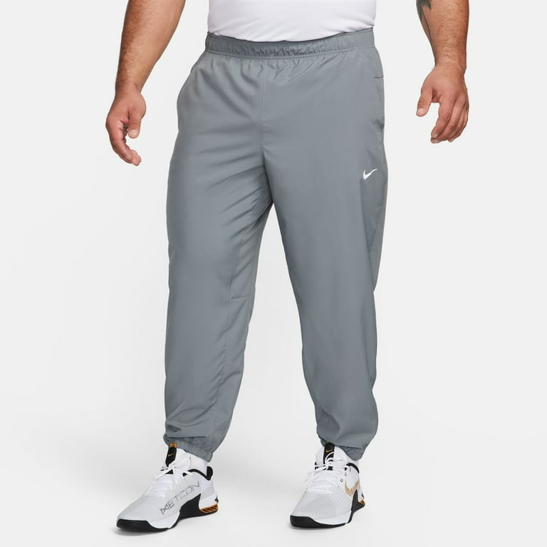 nike dress pants mens Men's Totality Dri-Fit Open Hem Versatile Pants, Black/White, Small : Clothing, Shoes & Jewelry stretch fabric gives a flexible feel and supple fit that lets you focus fully on your game Amazon.com : NIKE Men's Flex