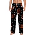 thumbnail image 1 of Men's pajama pants with brown football and playbook pattern on black background， soft home pajama pants， casual and comfortable loose fit pajama pants， elastic waistband, 1 of 10