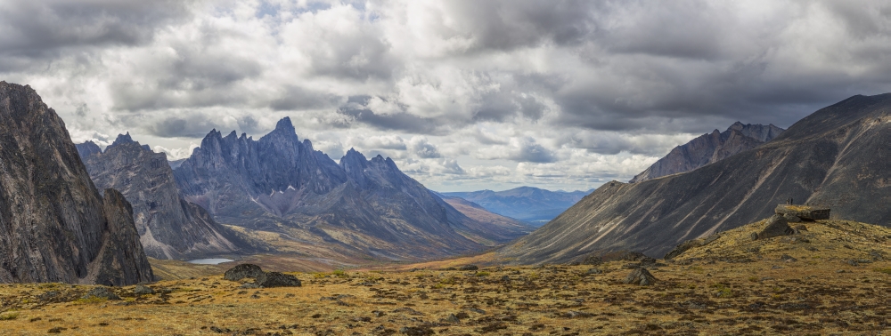 Men standing on a boulder in the distance in Tombstone Territorial Park in autumn Yukon Canada Canvas Art - Robert Postma Design Pics (35 x 13)