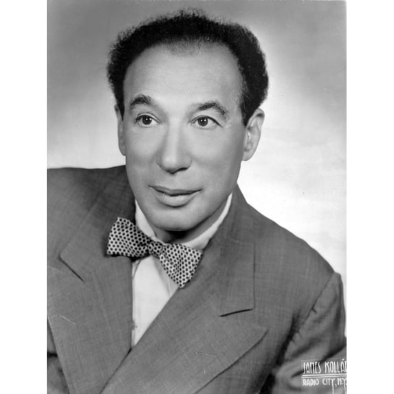 Menasha Skulnik wearing a patterned bow tie Photo Print (8 x 10)