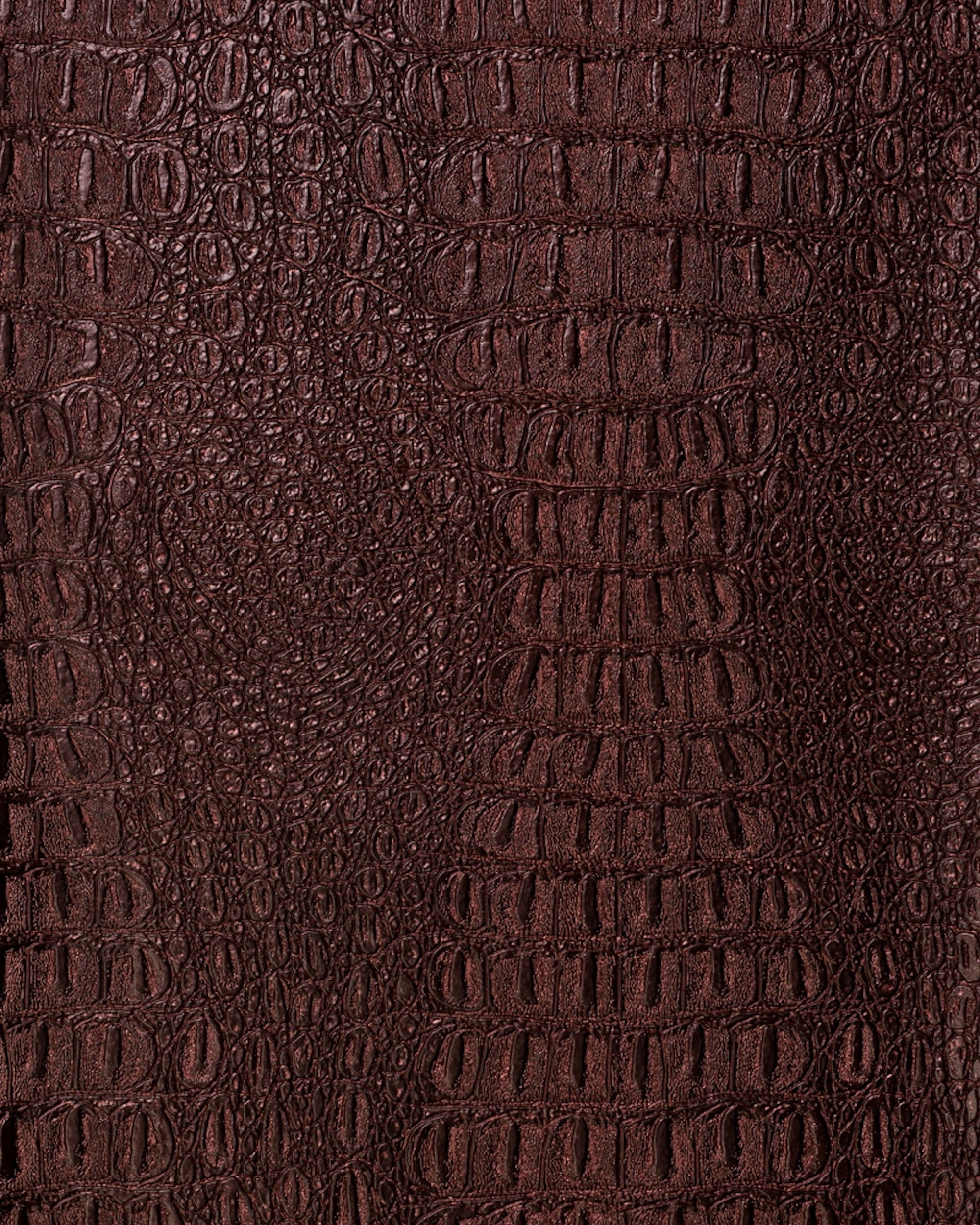 Metallic gator faux leather fabric designed with a flannel backing and ideal for upholstery projects, accent pieces, automobile upholstery, design, crafts, and much more.