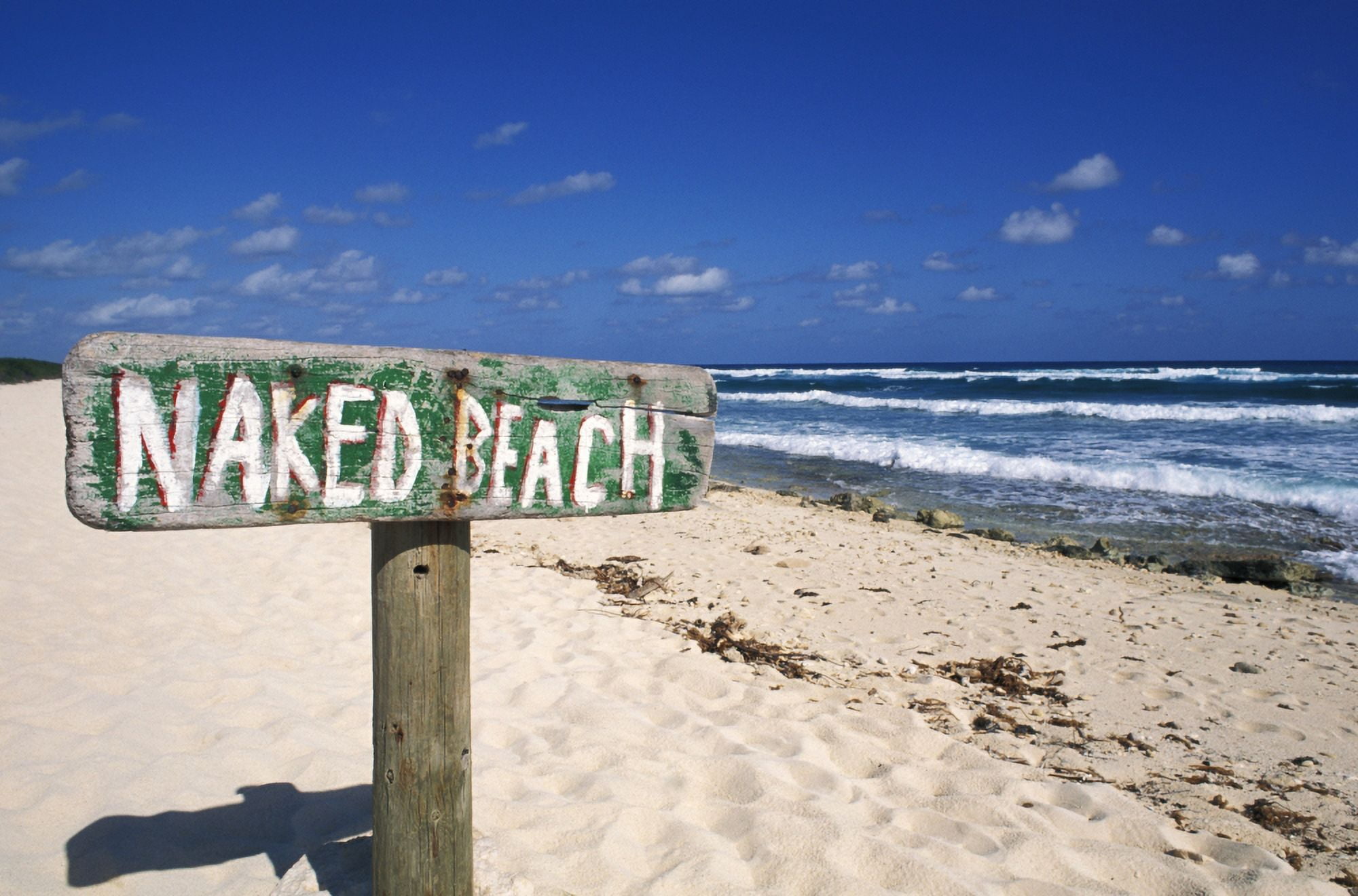 Mexico Yucatan Peninsula Cozumel Naked Beach Sign In Sand Ocean And Blue Sky In Background Canvas Art - Bill Bachmann Design Pics (17 x 11)