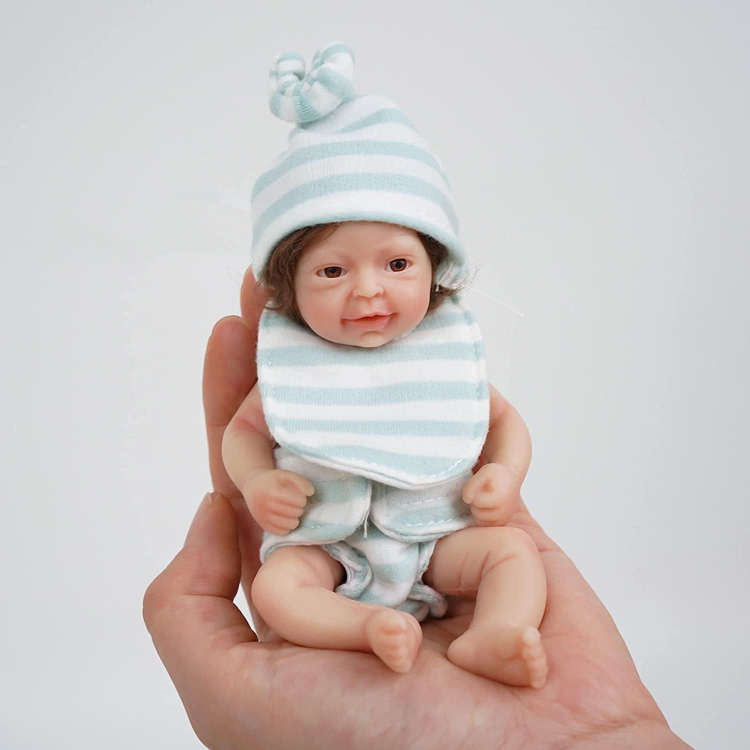 https://i5.walmartimages.com/seo/Miaio-7-inch-Mini-Baby-Reborn-Dolls-Realistic-Real-Full-Silicone-Body-Stress-Relief-for-Adults-Hand-Made-with-Feeding-Bathing-Accessories_eec432fa-4550-48c4-b1ac-49bedd5c2151.1a018e14d1e8f0a924d24a14f518d7f5.jpeg