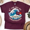 thumbnail image 1 of Micah 7:19 Scripture Shirt – Cast Your Sins Into the Sea T-Shirt with Ocean Art, Maroon, Size S, 1 of 6