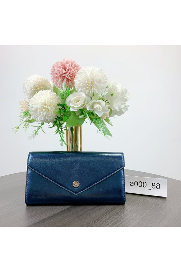 35H3STVE7M Jet Set Travel Large Metallic Envelope Wallet IN TEAL