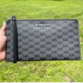 thumbnail image 1 of Michael Kors Large Zip Clutch Jet Set Signature Wristlet Black Mk Signature Logo, 1 of 7