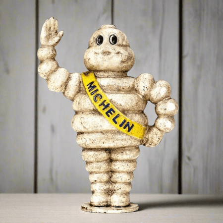 Tire Man Cast Iron Coin Bank With Painted Antique Finish (6.5" x 6")