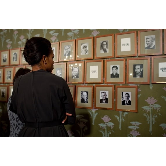 Michelle Obama Looks At Pictures Of Past Nobel Prize Recipients At The Norwegian Nobel Institute In Oslo Norway Dec. 10