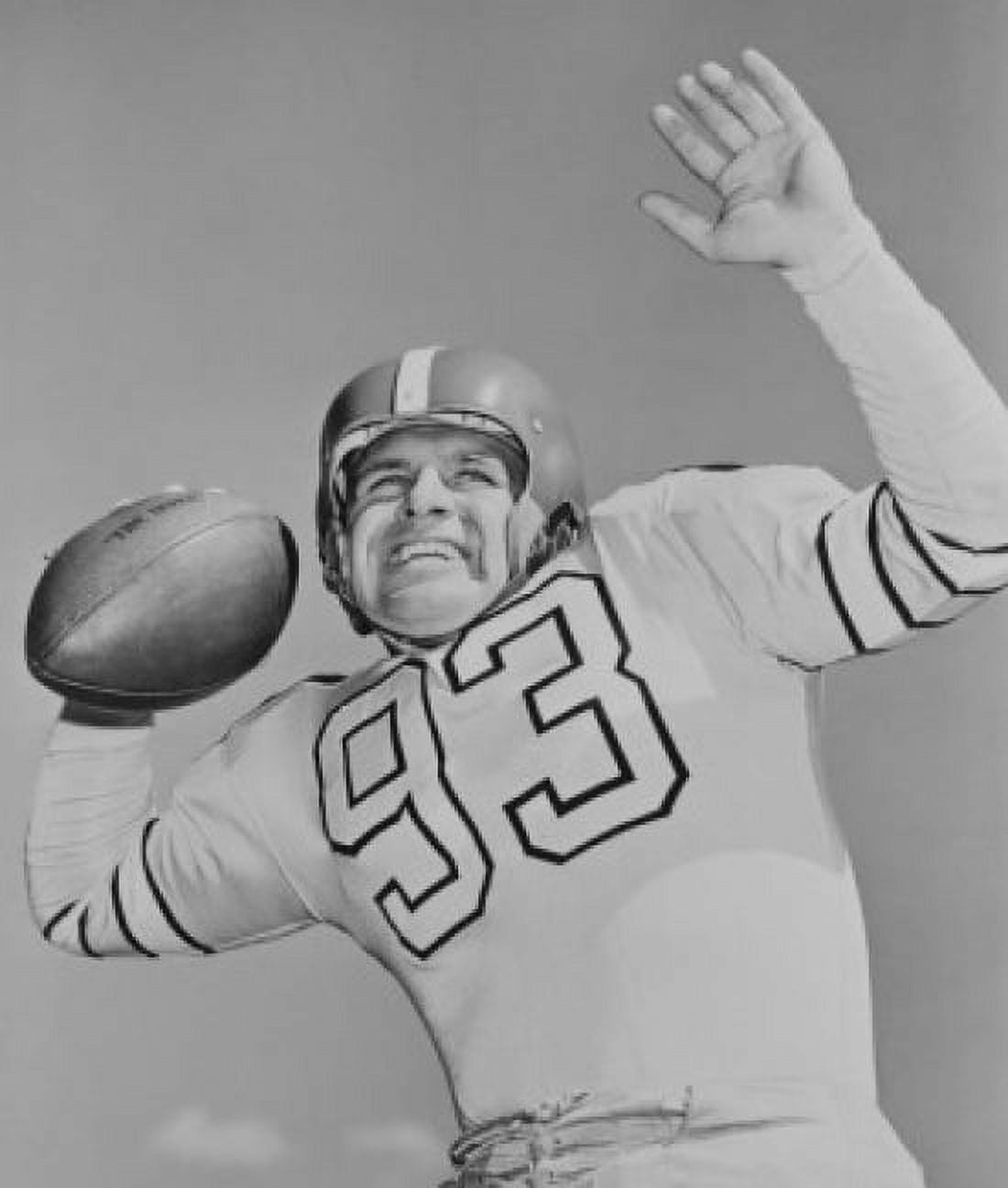 Mid adult American football player holding football Canvas Art - (18 x 24)