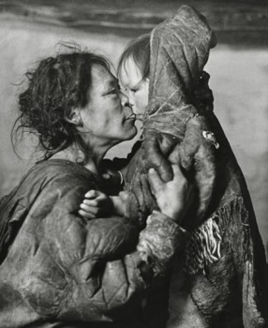 Mid adult Eskimo woman and her daughter rubbing noses Canvas Art - (18 x 24)