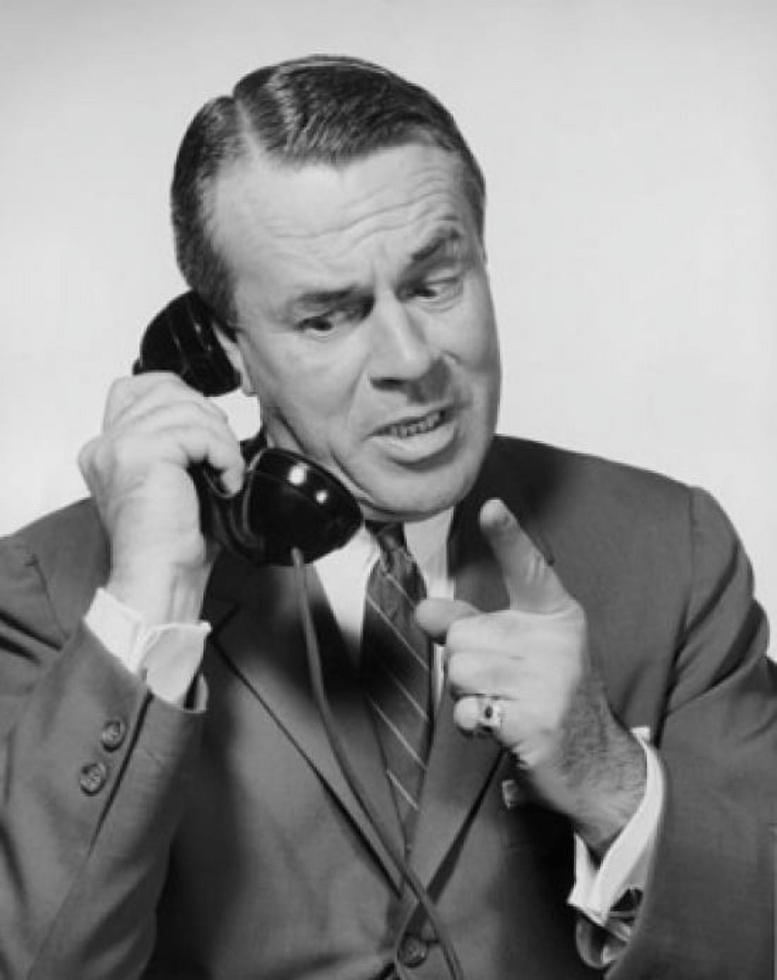Mid adult businessman talking on telephone Canvas Art - (24 x 36)