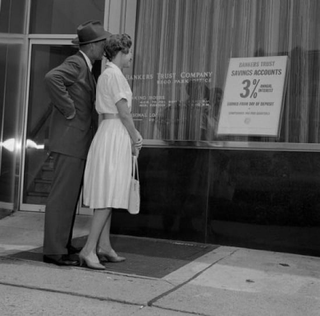 Mid adult couple examining bank offer standing outside bank Canvas Art - (18 x 24)