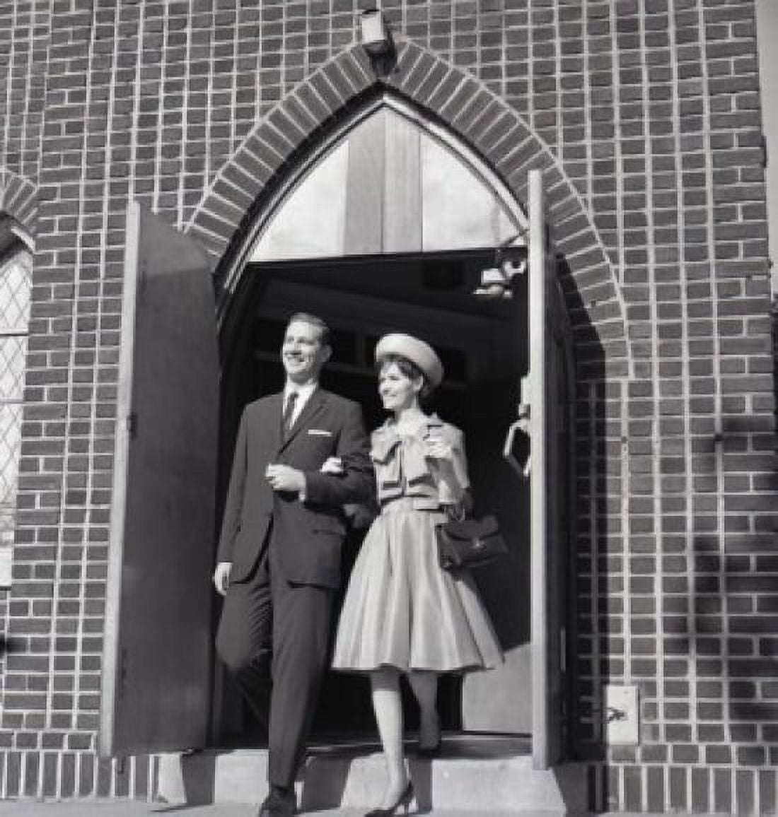 Mid adult couple leaving church Canvas Art - (24 x 36)