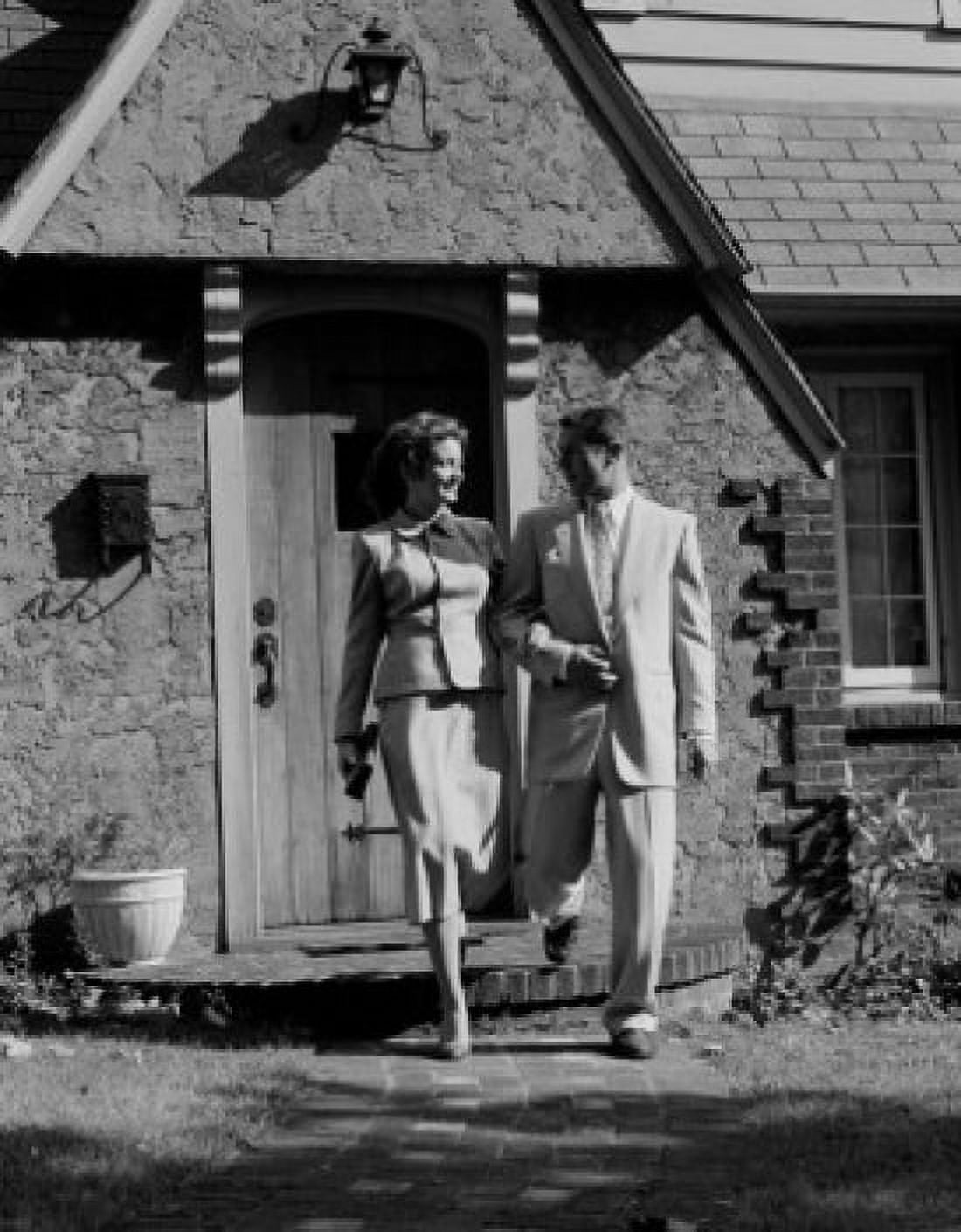 Mid adult couple leaving house Canvas Art - (18 x 24)