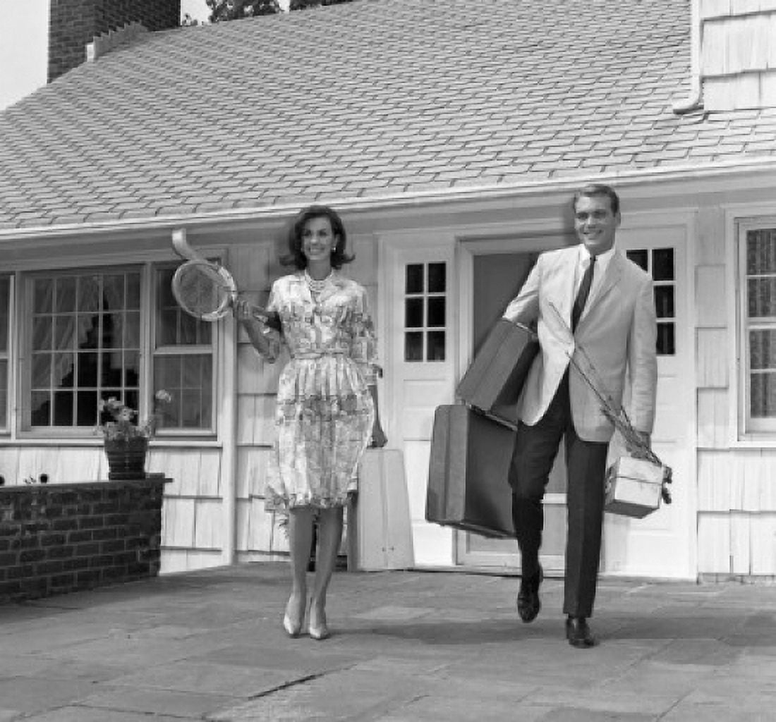 Mid adult couple leaving house and going on vacations Canvas Art - (24 x 36)