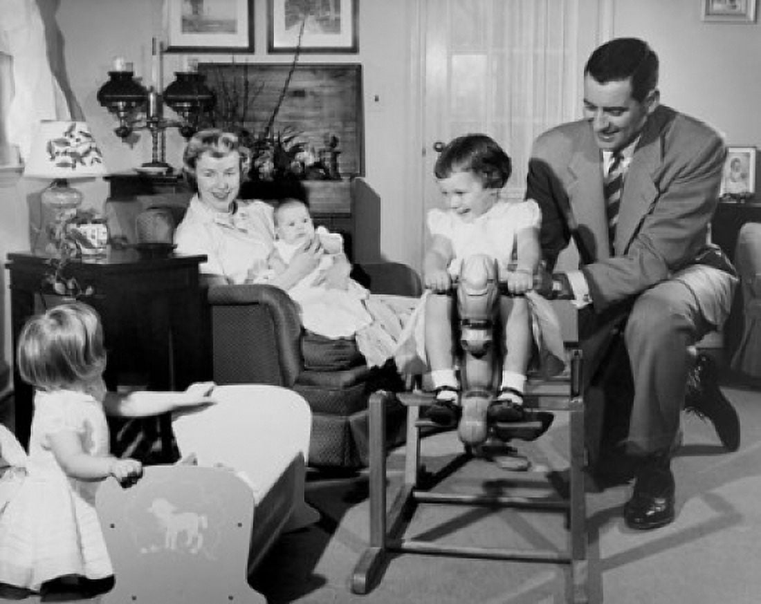 Mid adult couple playing with children in living room Canvas Art - (24 x 36)