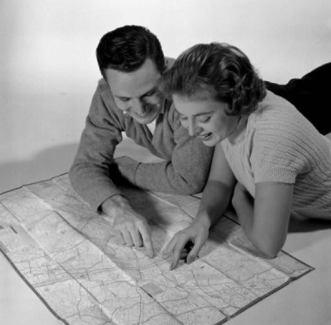 Mid adult couple reading map Canvas Art -  (24 x 36)