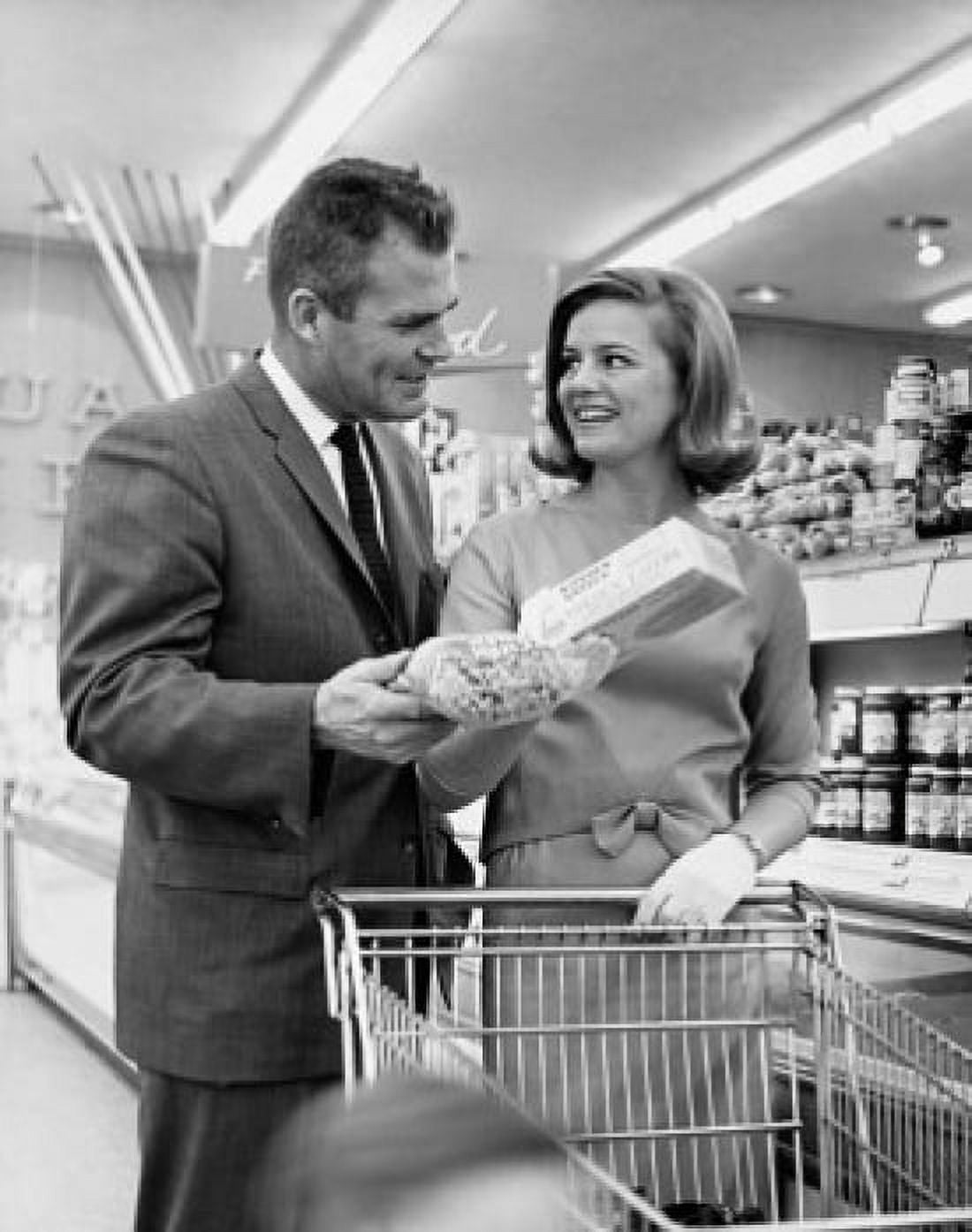Mid adult couple shopping in a store Canvas Art - (24 x 36)