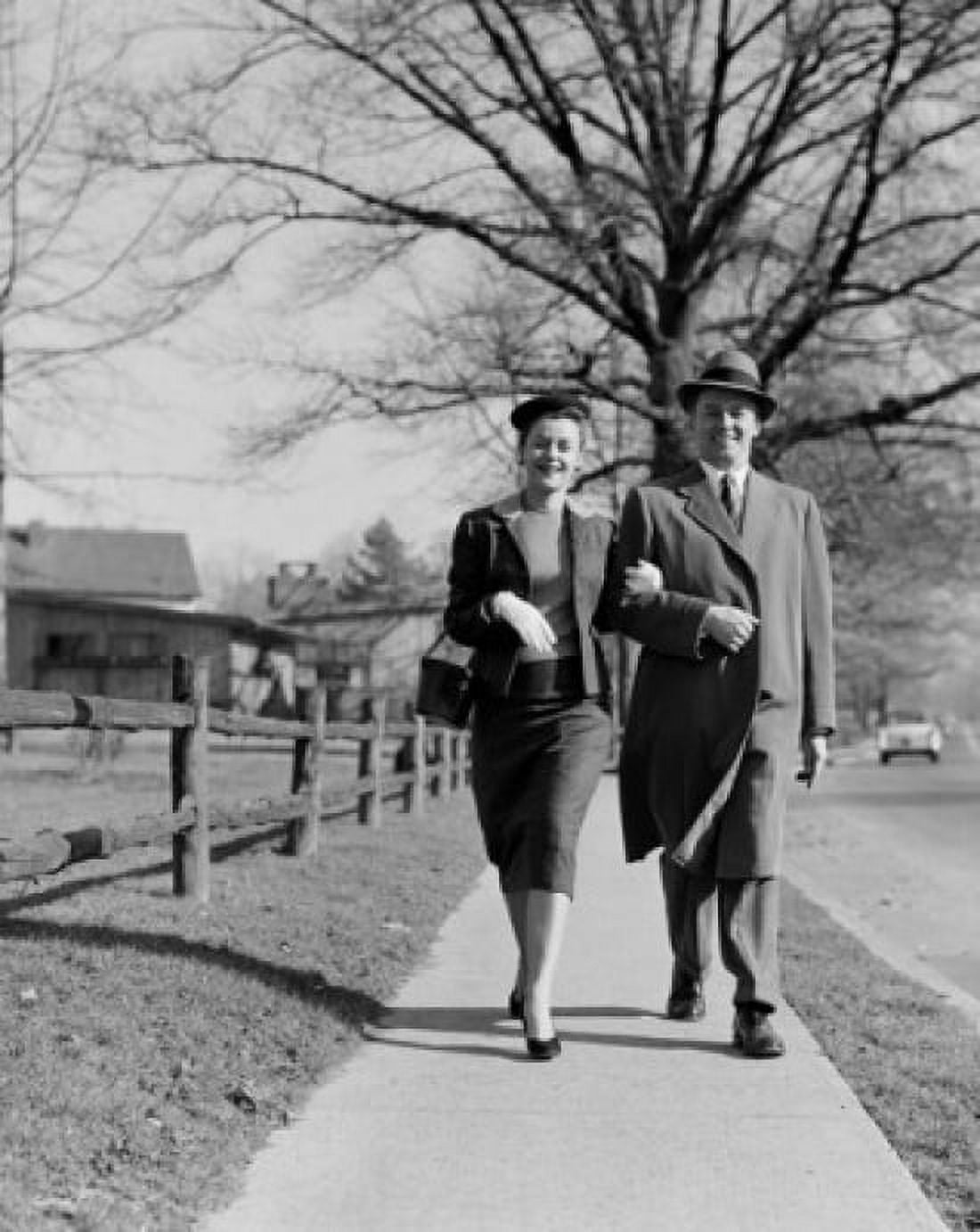 Mid adult couple walking down street Canvas Art - (24 x 36)