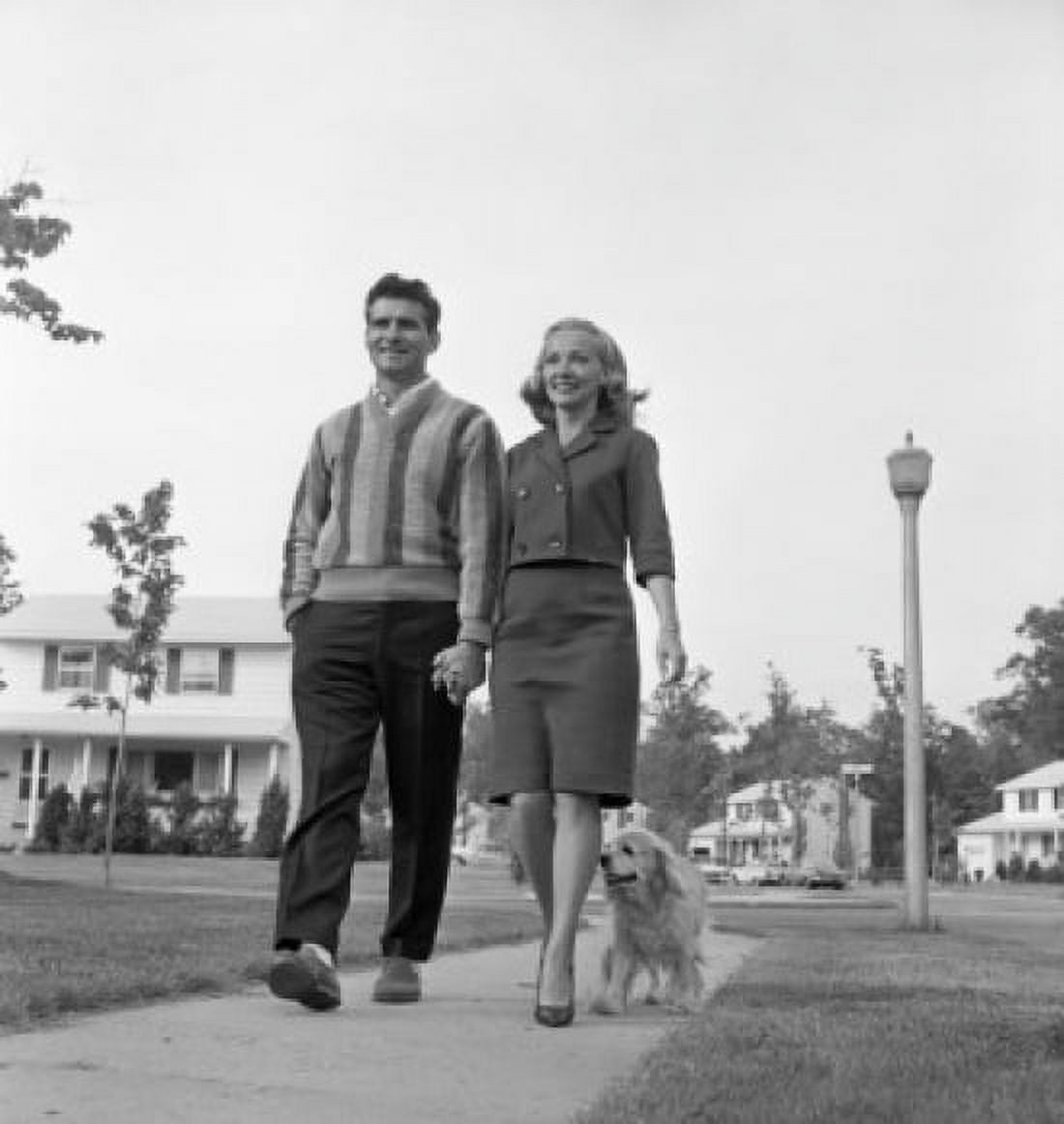 Mid-adult couple walking with dog Canvas Art - (24 x 36)