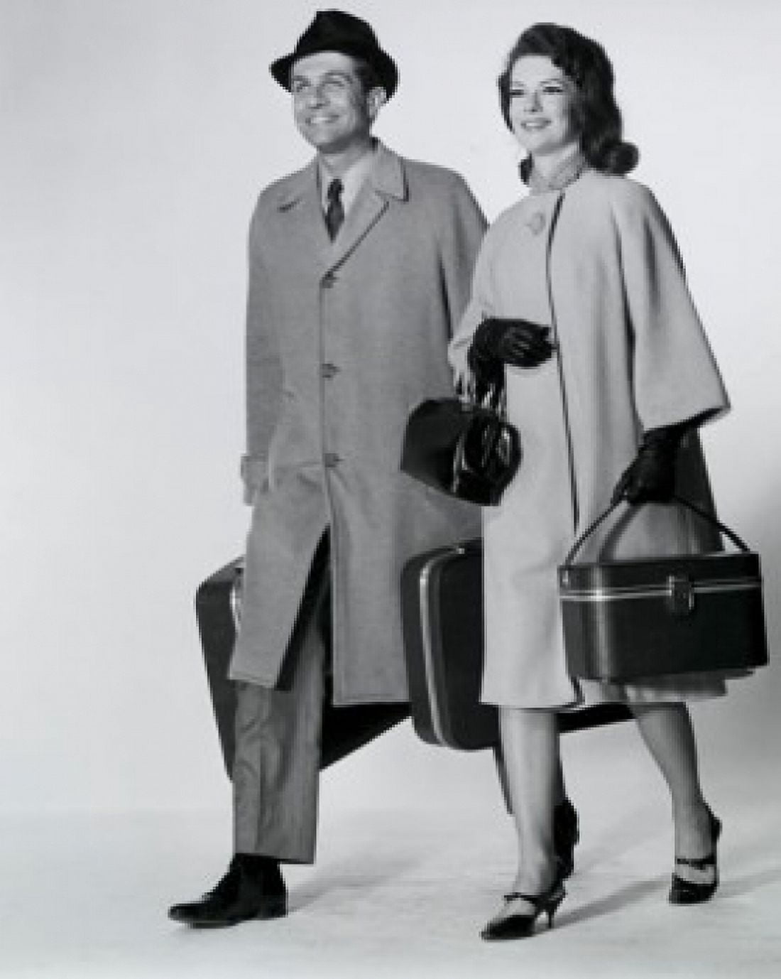 Mid adult couple walking with luggage Canvas Art - (18 x 24)