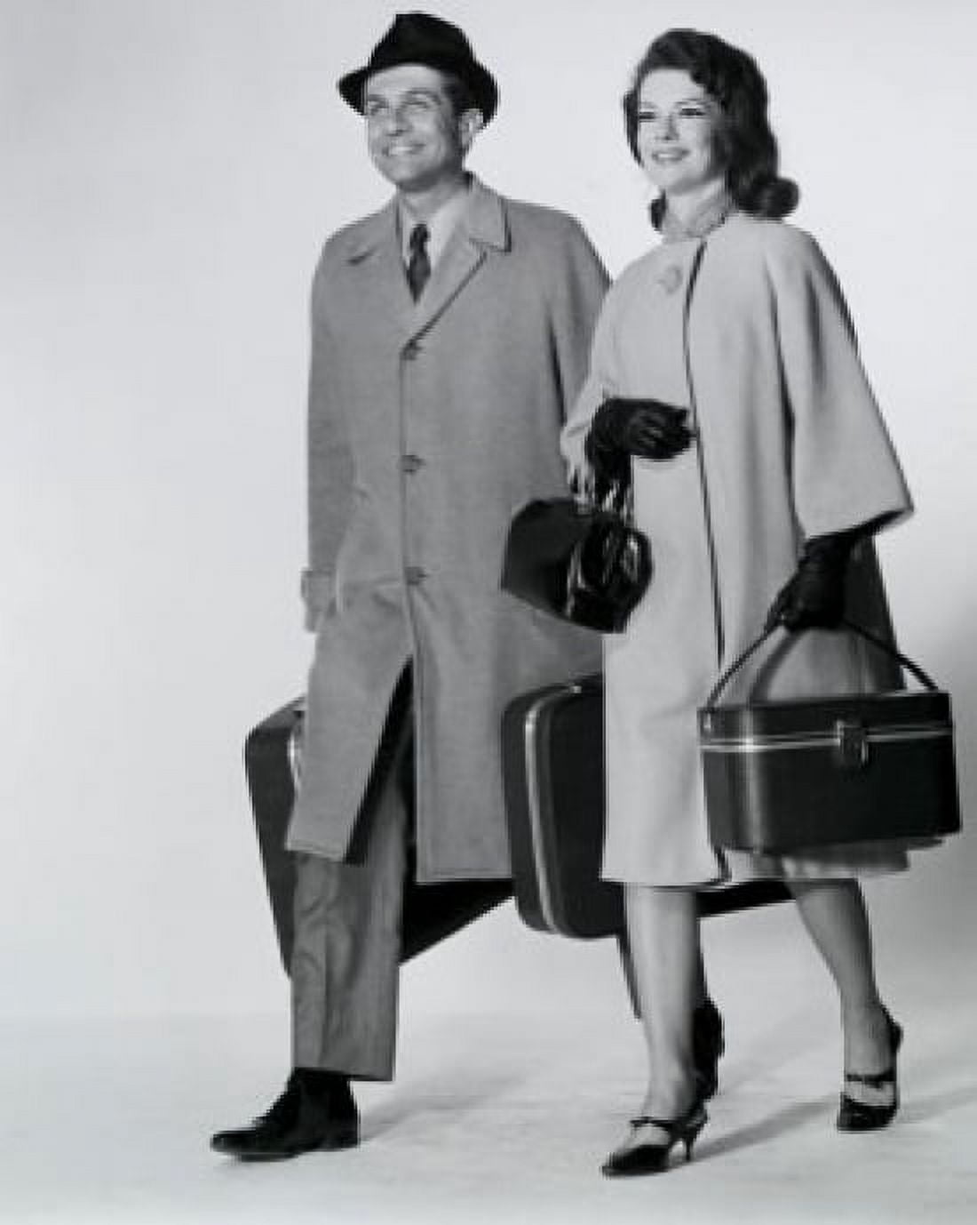 Mid adult couple walking with luggage Canvas Art - (24 x 36)