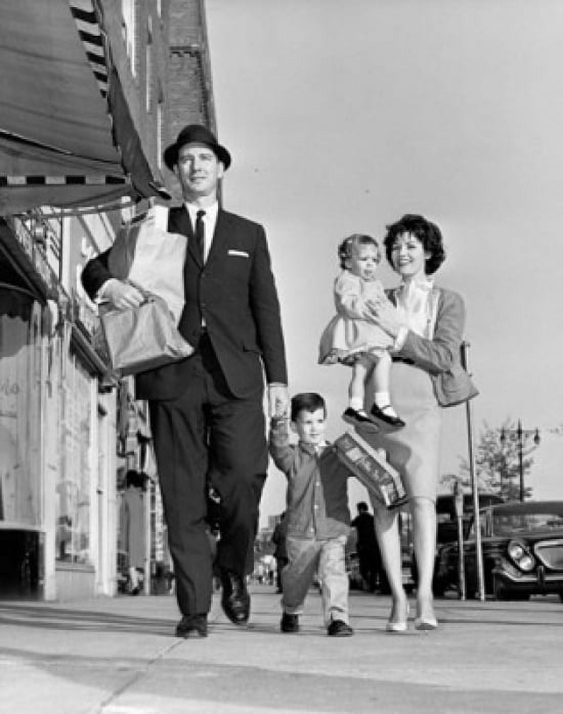 Mid adult couple with their children walking on the sidewalk Canvas Art - (24 x 36)