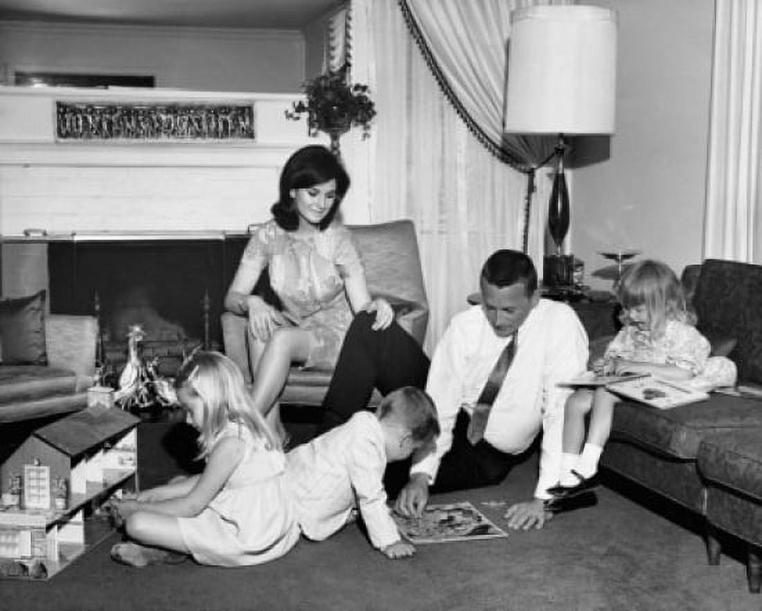 Mid adult couple with their three children near a fireplace Canvas Art - (18 x 24)