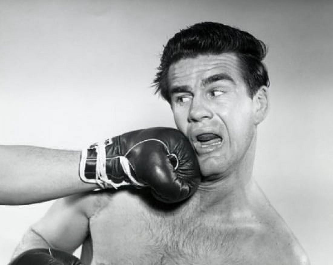 Mid adult man being hit by a punch Canvas Art - (18 x 24)