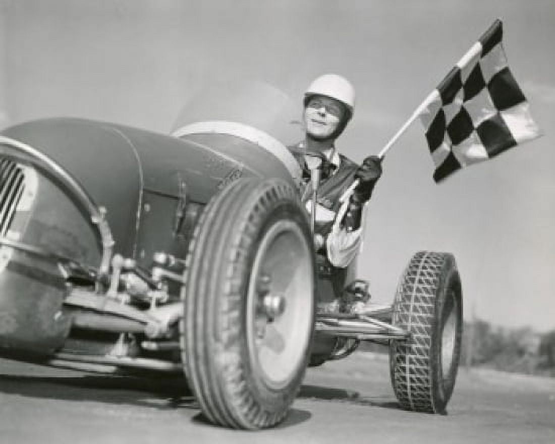 Mid adult man driving a car and holding a checkered flag Canvas Art - (18 x 24)