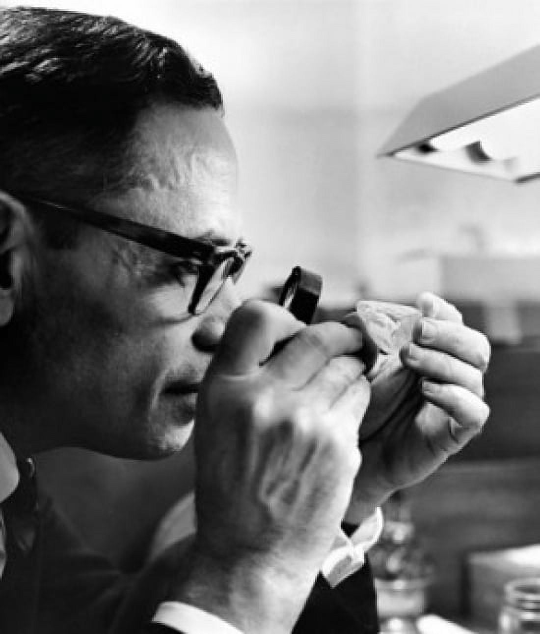 Mid adult man examining a diamond with the help of a magnifying glass Canvas Art - (18 x 24)