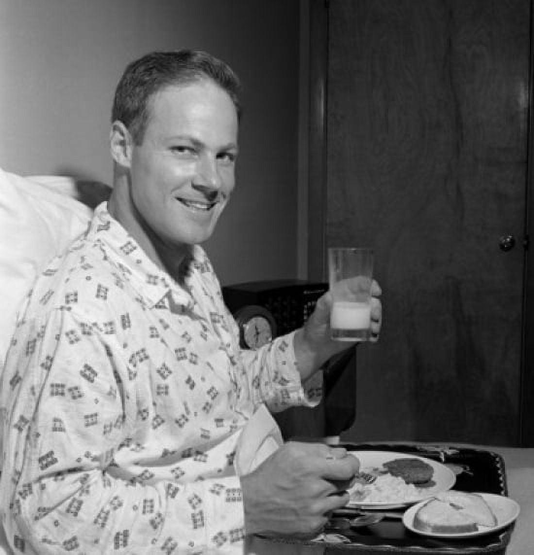 Mid adult man having breakfast in bed Canvas Art - (18 x 24)