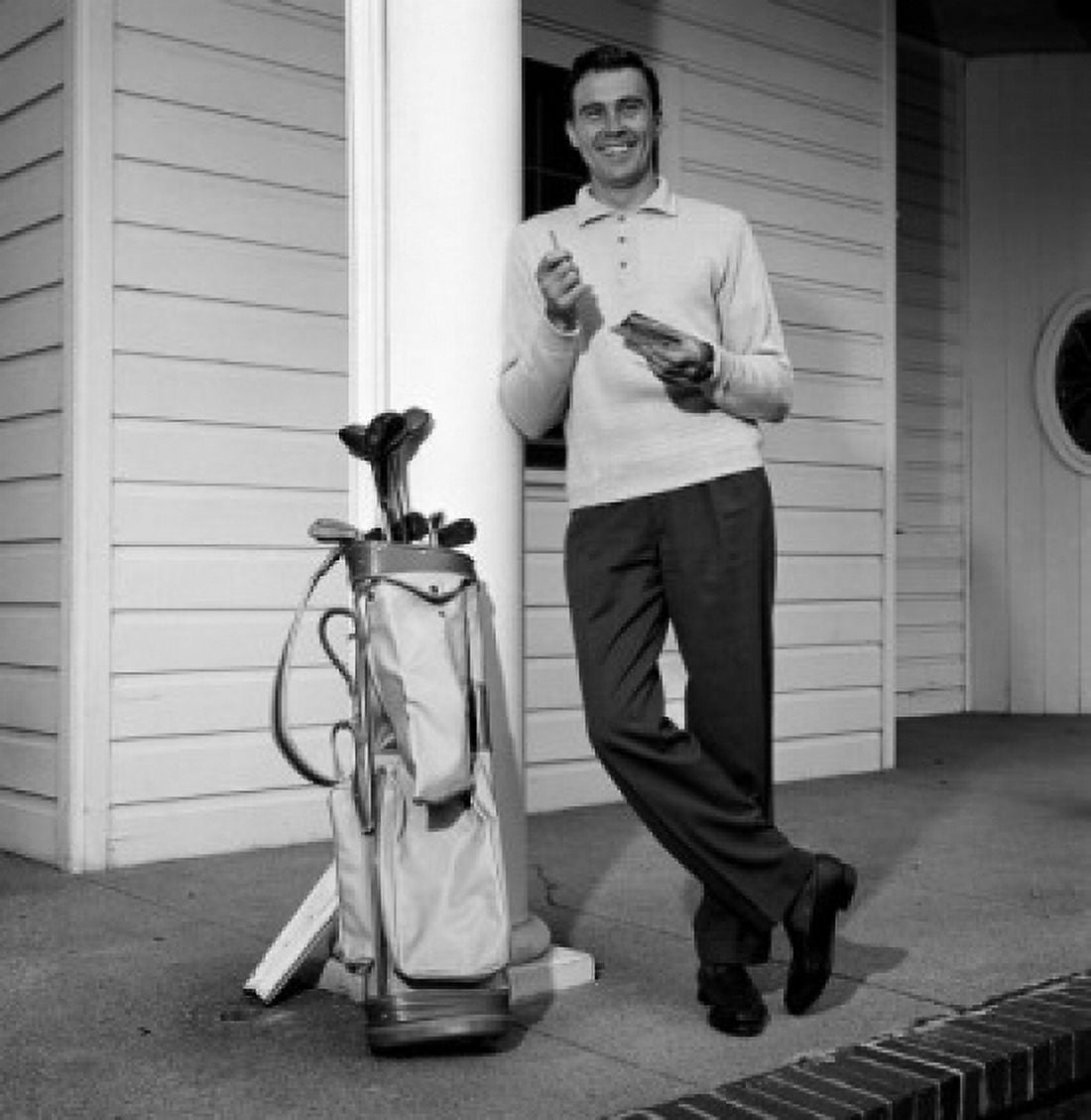 Mid adult man leaning against column with golf trolley beside Canvas Art - (18 x 24)
