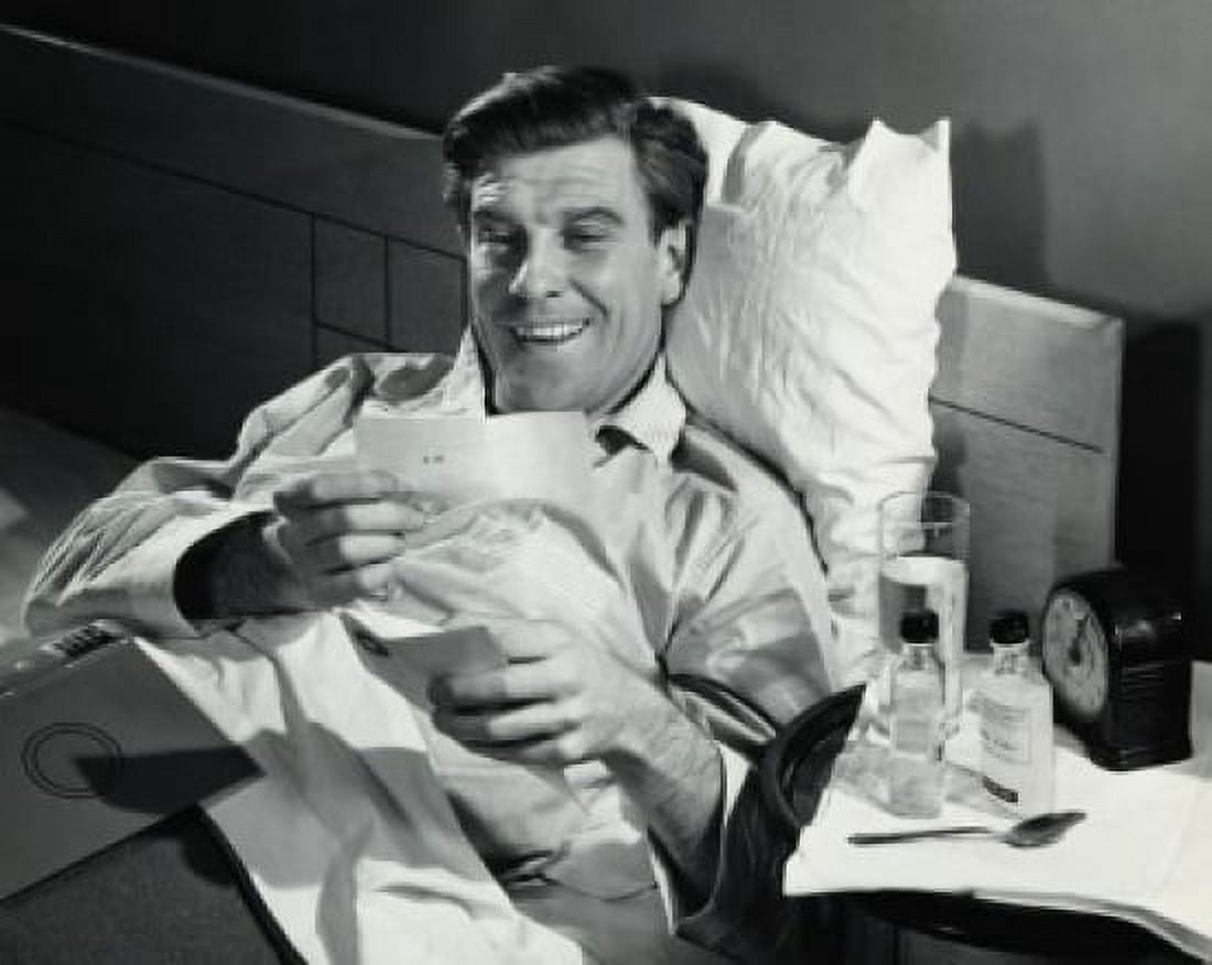 Mid adult man looking at a check Canvas Art - (24 x 36)