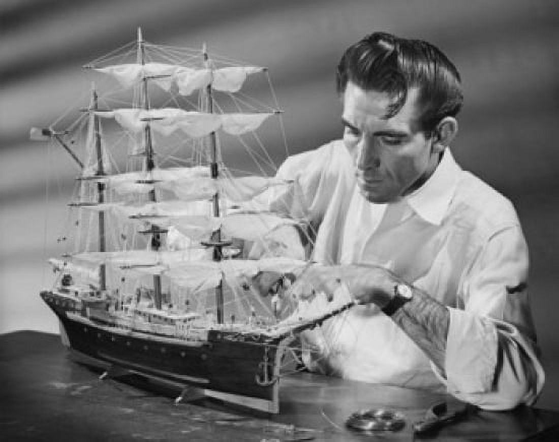 Mid adult man making a model of a sailing ship Canvas Art - (24 x 36)