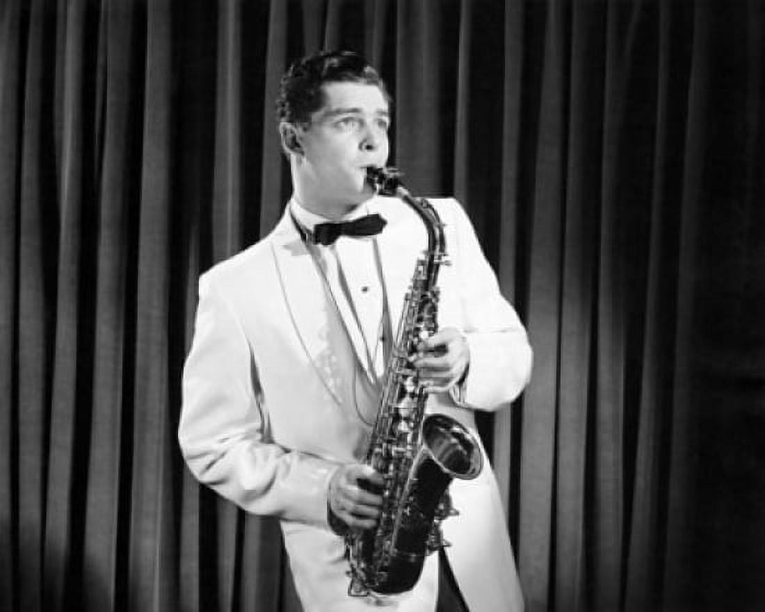 Mid adult man playing a saxophone on stage Canvas Art - (18 x 24)