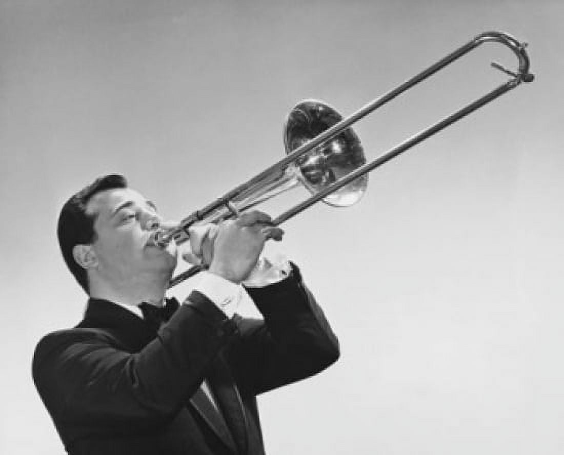 Mid adult man playing a trombone Canvas Art - (18 x 24)