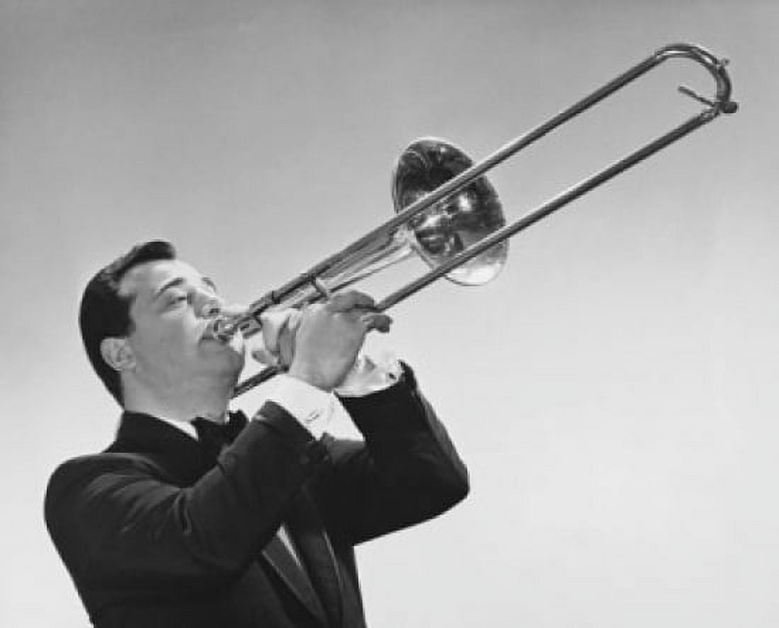 Mid adult man playing a trombone Canvas Art - (24 x 36)