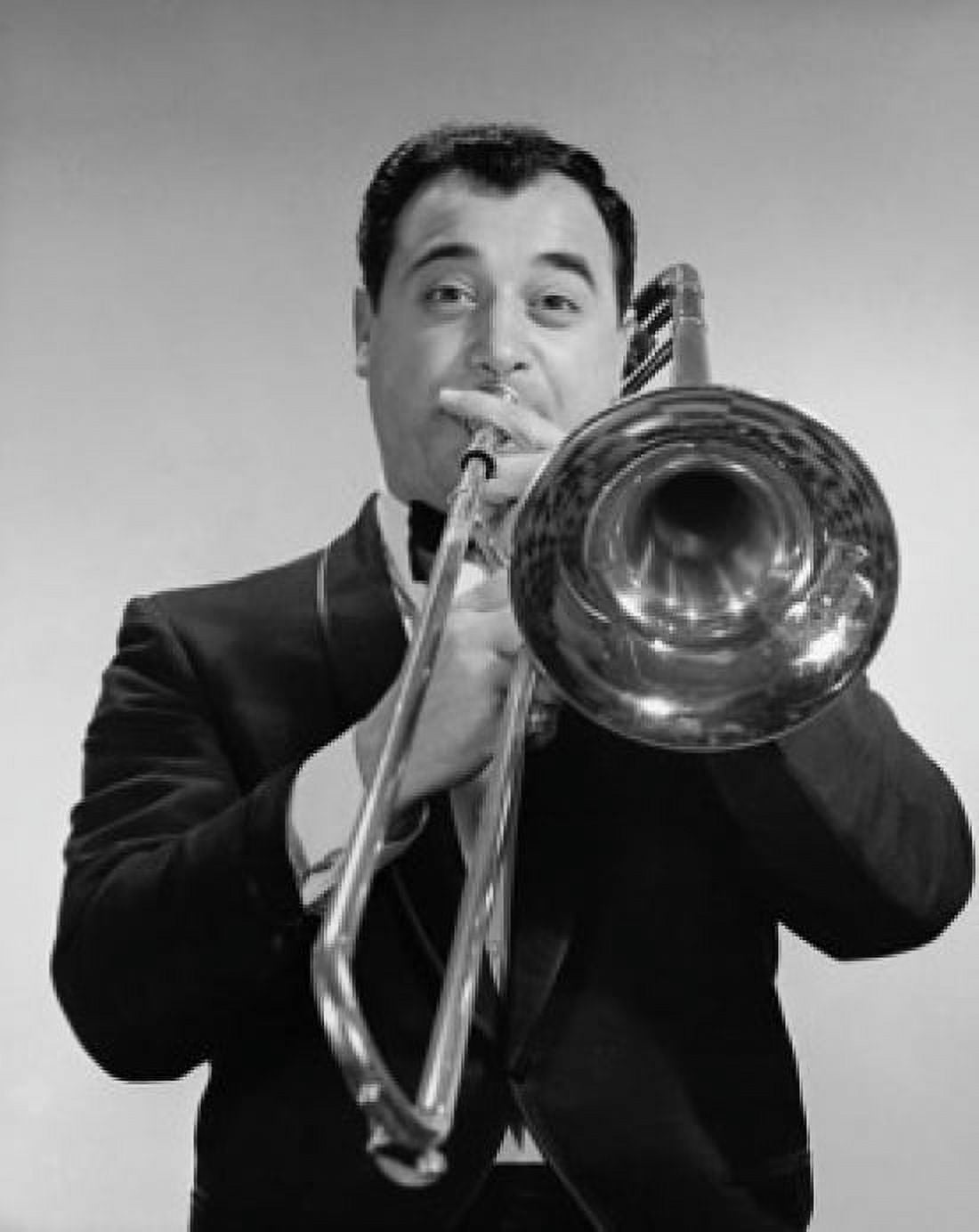 Mid adult man playing a trombone Canvas Art - (24 x 36)