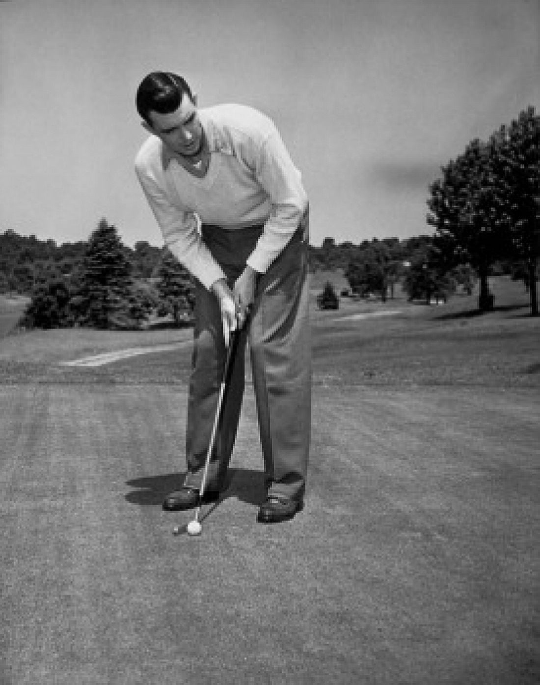 Mid adult man playing golf Canvas Art - (18 x 24)