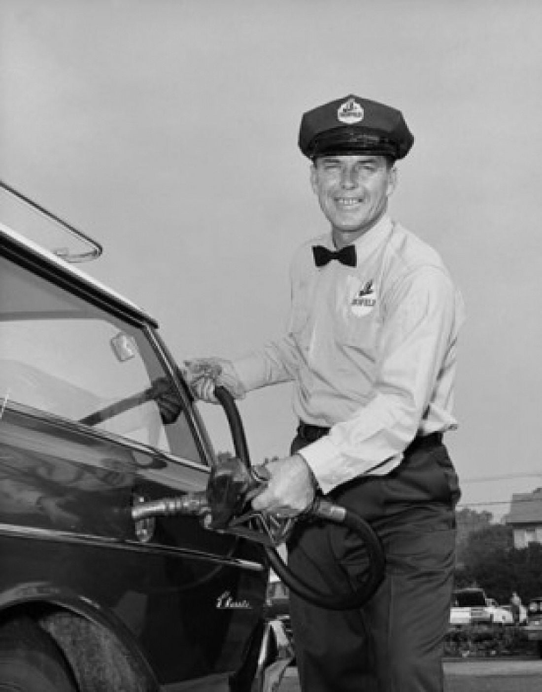 Mid adult man refueling a car at a gas station Canvas Art - (24 x 36)