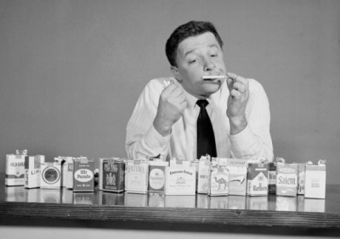 Mid adult man smelling a cigarette Canvas Art - (24 x 36)